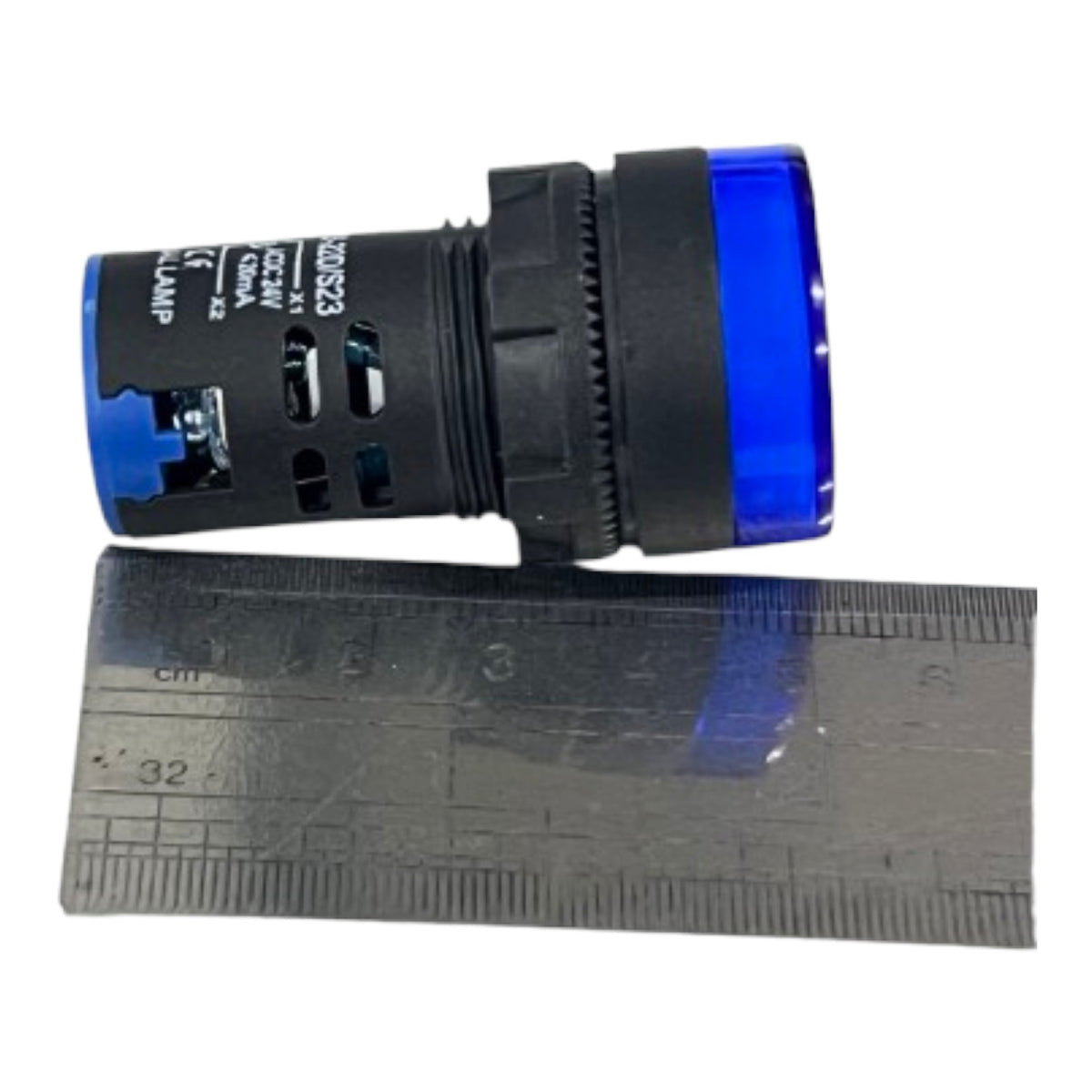 A black industrial push-button switch with blue translucent end caps, shown alongside a metal ruler for scale on a white background.