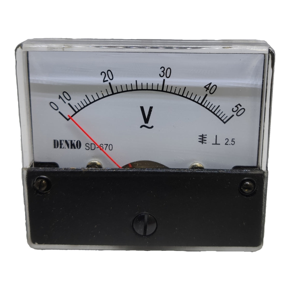A Denko SD-670 analog multimeter voltage gauge with a clear protective cover, black case, and white dial showing a red needle.
