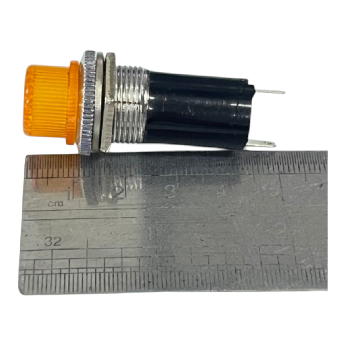 A small industrial electrical push-button switch with an orange ribbed plastic end, a silver metal threaded body, and a black plastic housing, shown next to a metal ruler for scale on a white background.