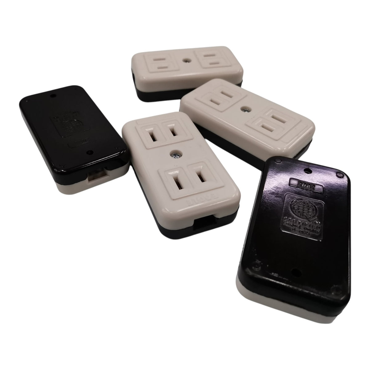 Four small electrical outlet covers or adapters shown on a plain white background, with two in black and two in off-white/cream.