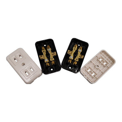 Four electrical outlet components arranged on a white background: one closed beige faceplate, one open black backplate showing gold-toned internal terminals, and two additional beige backplates.