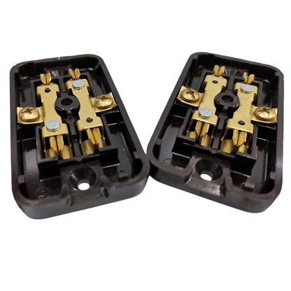 Two black electrical terminal blocks with gold-colored metal contacts, shown on a plain white background.