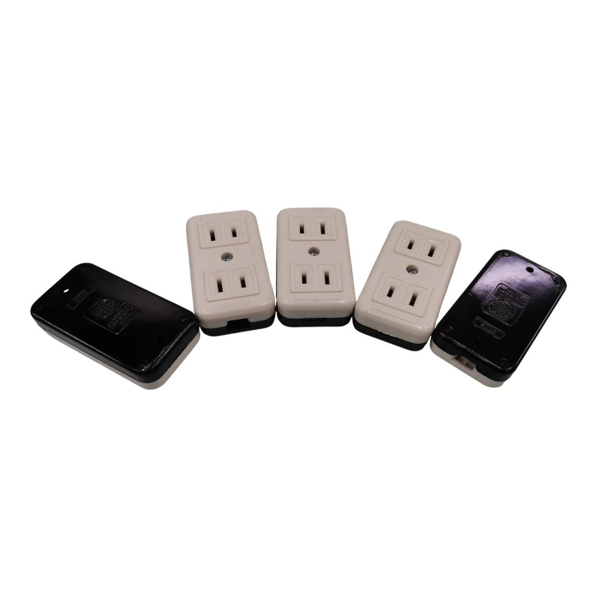 Four electrical outlet covers arranged on a white background, including two black and two beige outlets with protective covers.
