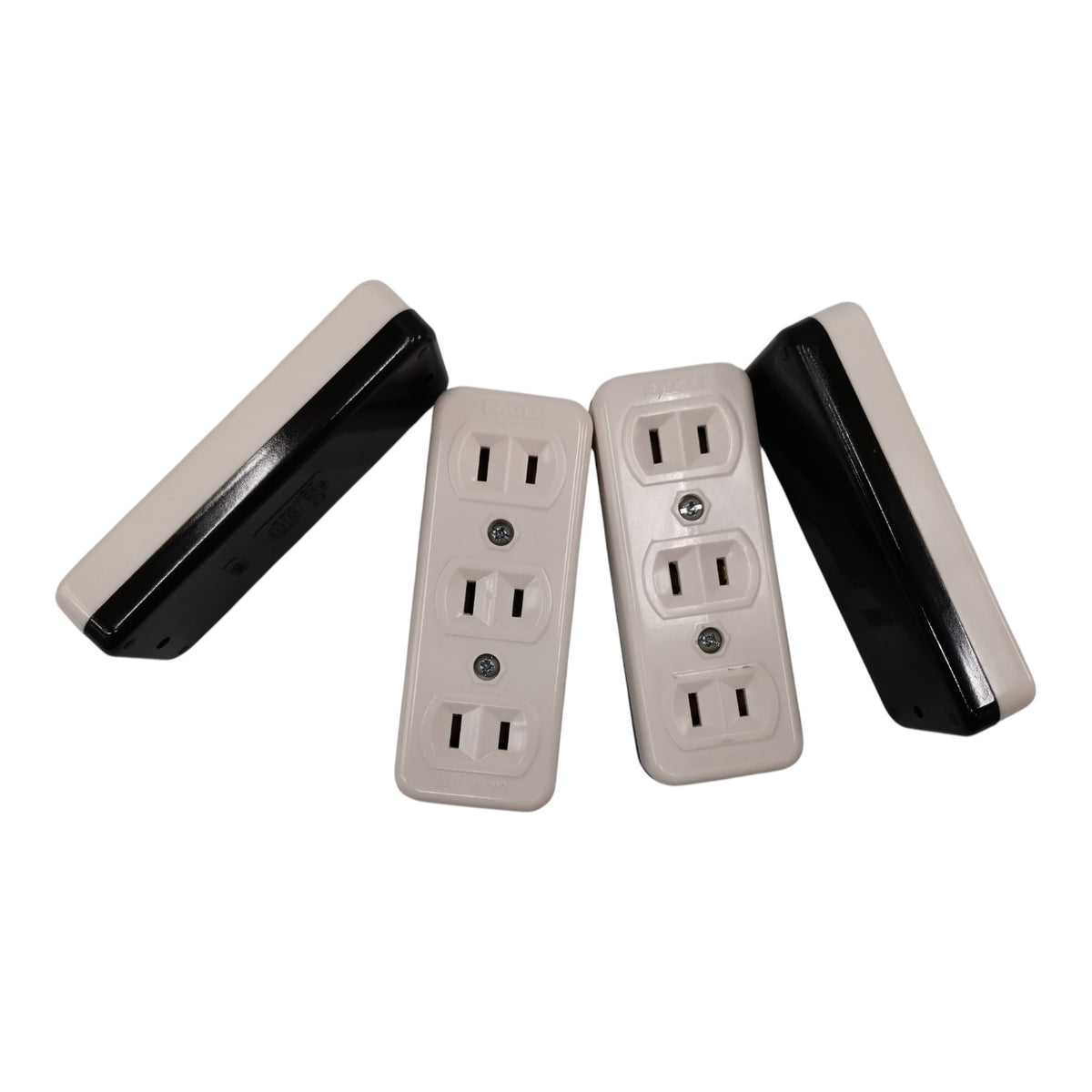 Four rectangular outlet covers or electrical faceplates shown on a plain white background, with two front views and two side views. The front faces are warm off-white/cream, and the sides are black.