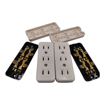 Four electrical outlet components arranged on a white background: two beige outlet covers in the center, two black outlet backings with gold-toned terminals on the sides, and two beige plastic trays behind the outlets.