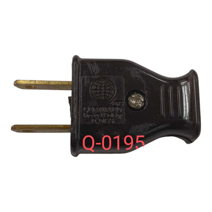 A black plastic two-pin electrical plug adapter with brass-toned pins, shown on a plain white background with a red text overlay reading 'Q-0195'.