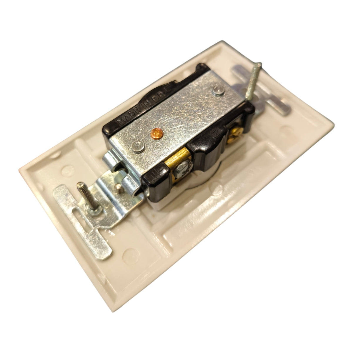 A close-up of a door latch mechanism mounted on a beige plastic backplate, isolated on a white background.