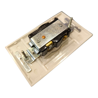 A close-up of a door latch mechanism mounted on a beige plastic backplate, isolated on a white background.