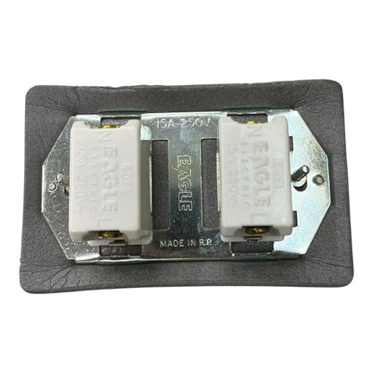 An Eagle brand 15A-250V double pole electrical contactor relay module, featuring two white plastic relays mounted on a silver metal plate with a black textured backing.