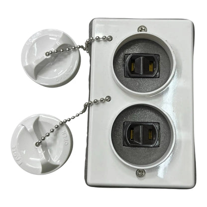 A white plastic dual outlet electrical outlet cover plate with two round outlets and two matching white plastic caps connected by silver ball chains, shown on a white background.