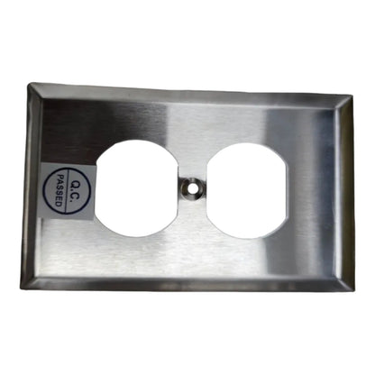 A brushed stainless steel double outlet electrical cover plate with a small 'PASSED O.C.