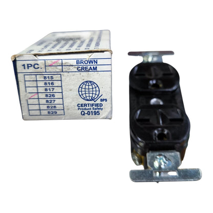 A black electrical outlet component shown next to its original white cardboard box on a plain white background.
