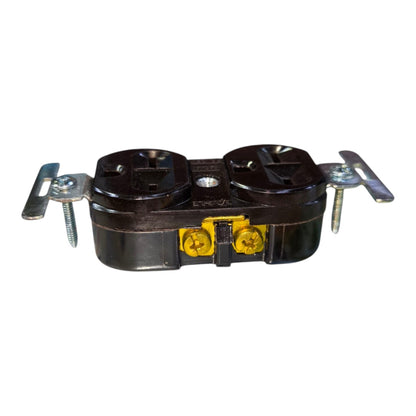 A black double outlet electrical junction box with silver metal mounting brackets and yellow screw terminals, isolated on a white background.
