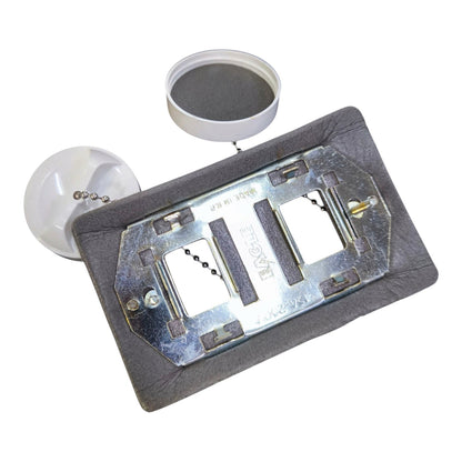 A metal insect trap plate with a gray fabric base, shown with a white plastic cap and a round gray filter or mesh component on a plain white background.