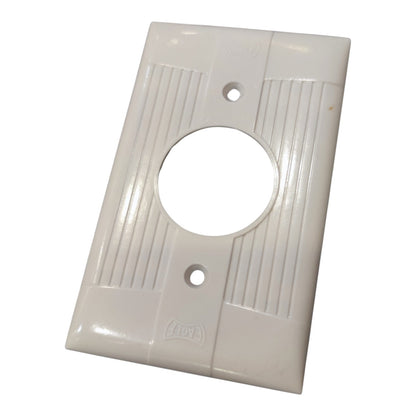 A white plastic double-gang outlet cover plate with a central circular cutout and ribbed decorative panels, shown on a plain white background.