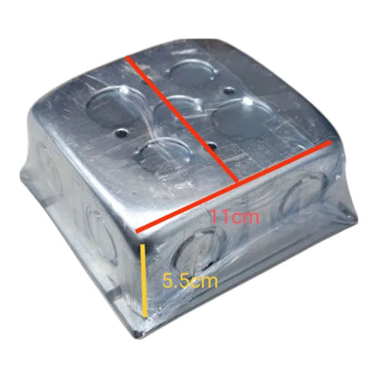 A square metallic electrical junction box with pre-drilled terminal holes, wrapped in clear protective plastic and overlaid with red and yellow dimension lines showing measurements of 11cm by 5.5cm on a white background.