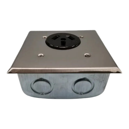 A stainless steel electrical junction box with a black 3-prong outlet on top and two circular conduit openings on the front, shown against a plain white background.