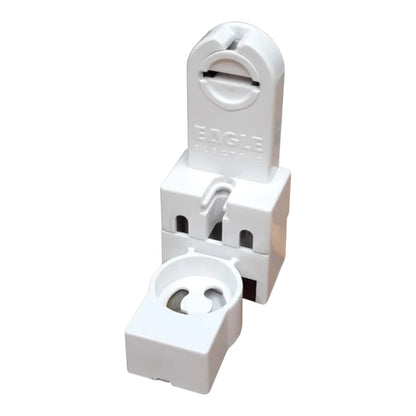 White plastic Eagle Electronics terminal block connector with a separate small white clip piece placed in front, shown on a plain white background.