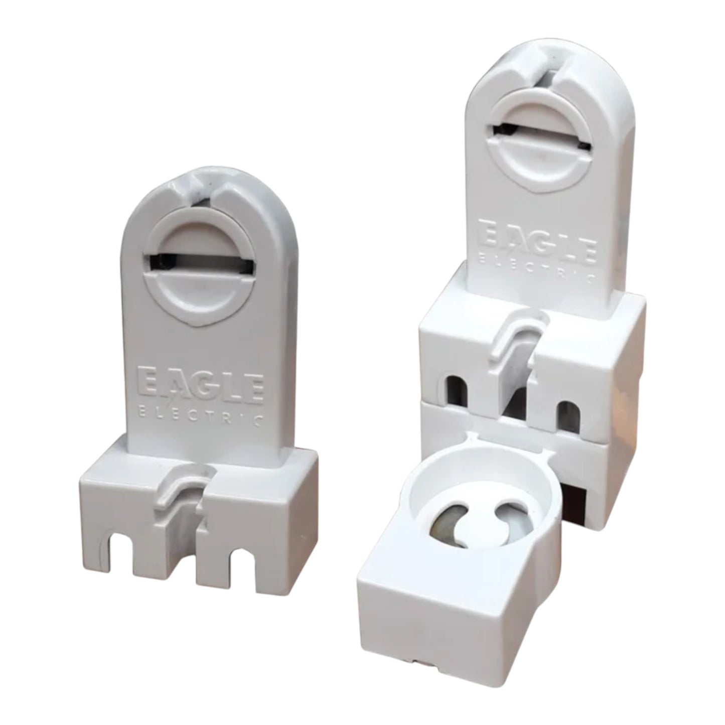 Three white plastic terminal blocks with the brand name EAGLE ELECTRIC embossed on them, shown against a plain white background.