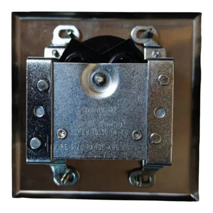 A square metal electrical terminal block or connector plate with four screw terminals, a black internal component, and stamped text on the center metal plate, isolated on a white background.