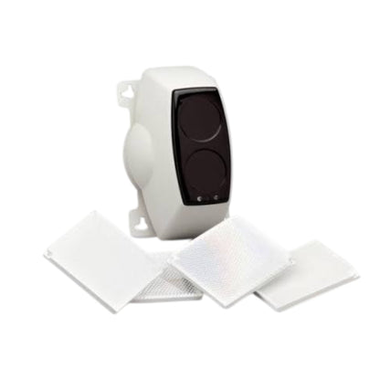 A white electronic device with a black front panel, shown with three white rectangular filter or pad pieces in front, on a plain white background.