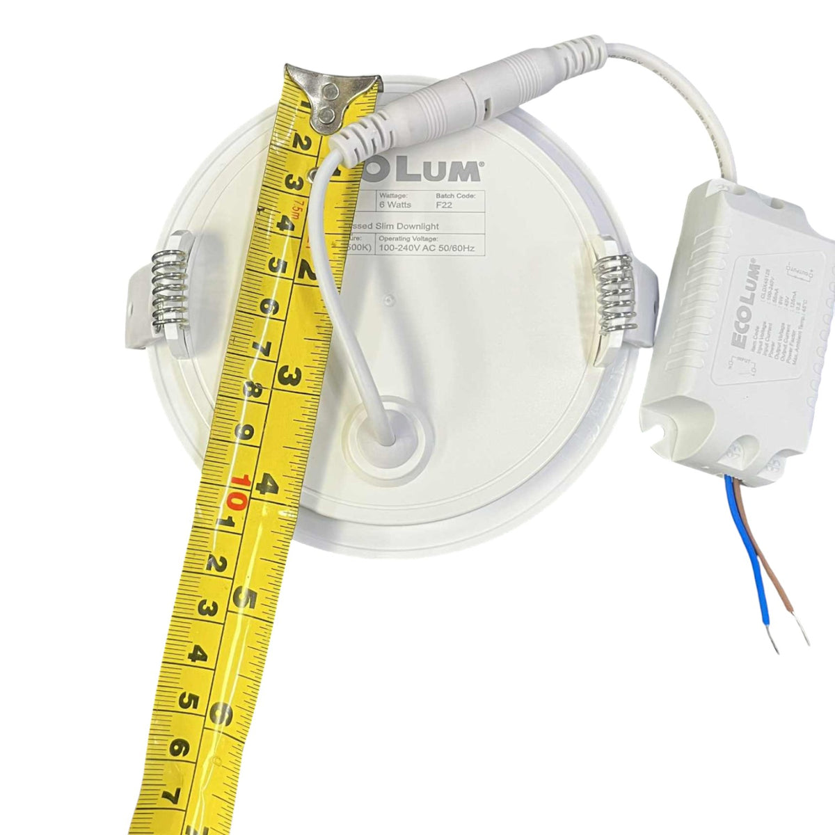 LED light fixture with a measuring tape for scale on a white background