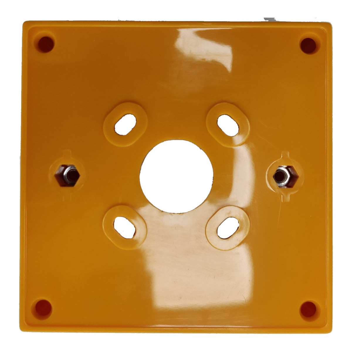 A square yellow-orange plastic electrical junction block or terminal cover with a central circular opening and four pre-drilled screw holes, shown on a white background.
