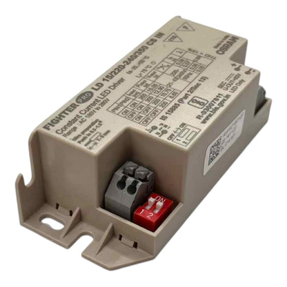 A beige industrial electronic module with printed technical specifications and a small red terminal piece, photographed on a plain white background.