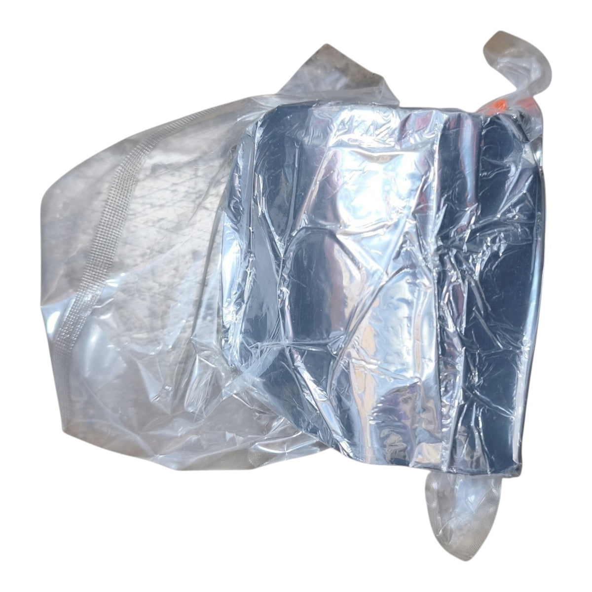 A crumpled silver reflective foil pouch or wrap on a plain white background.