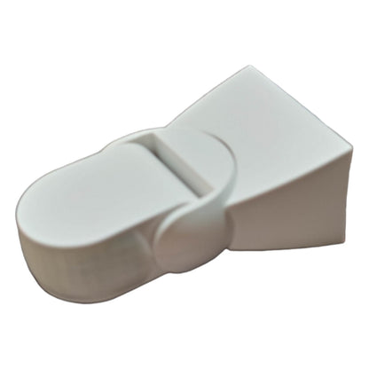 White plastic door stopper on a white background
