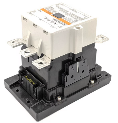 A heavy-duty electrical contactor or relay component with a white top housing and a black base, featuring metal terminal blocks and a printed technical specification label.