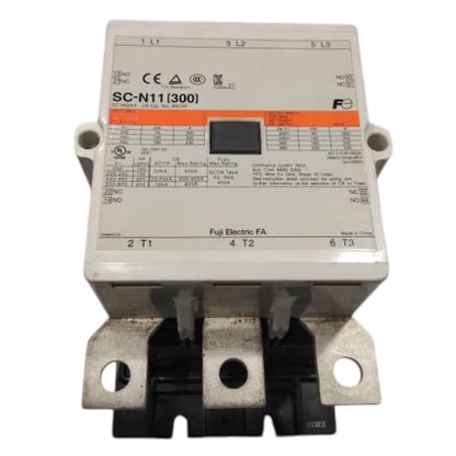 A Fujin Electric SC-N11 [300] contactor auxiliary power module, featuring a white plastic housing, printed technical specifications, an orange safety label, and three metal terminal blocks at the bottom.