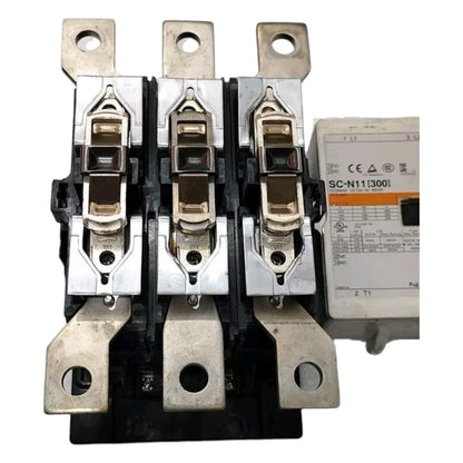 Three-phase electrical contactor with metal terminals and a white control module labeled SC-N11(300) on a white background.