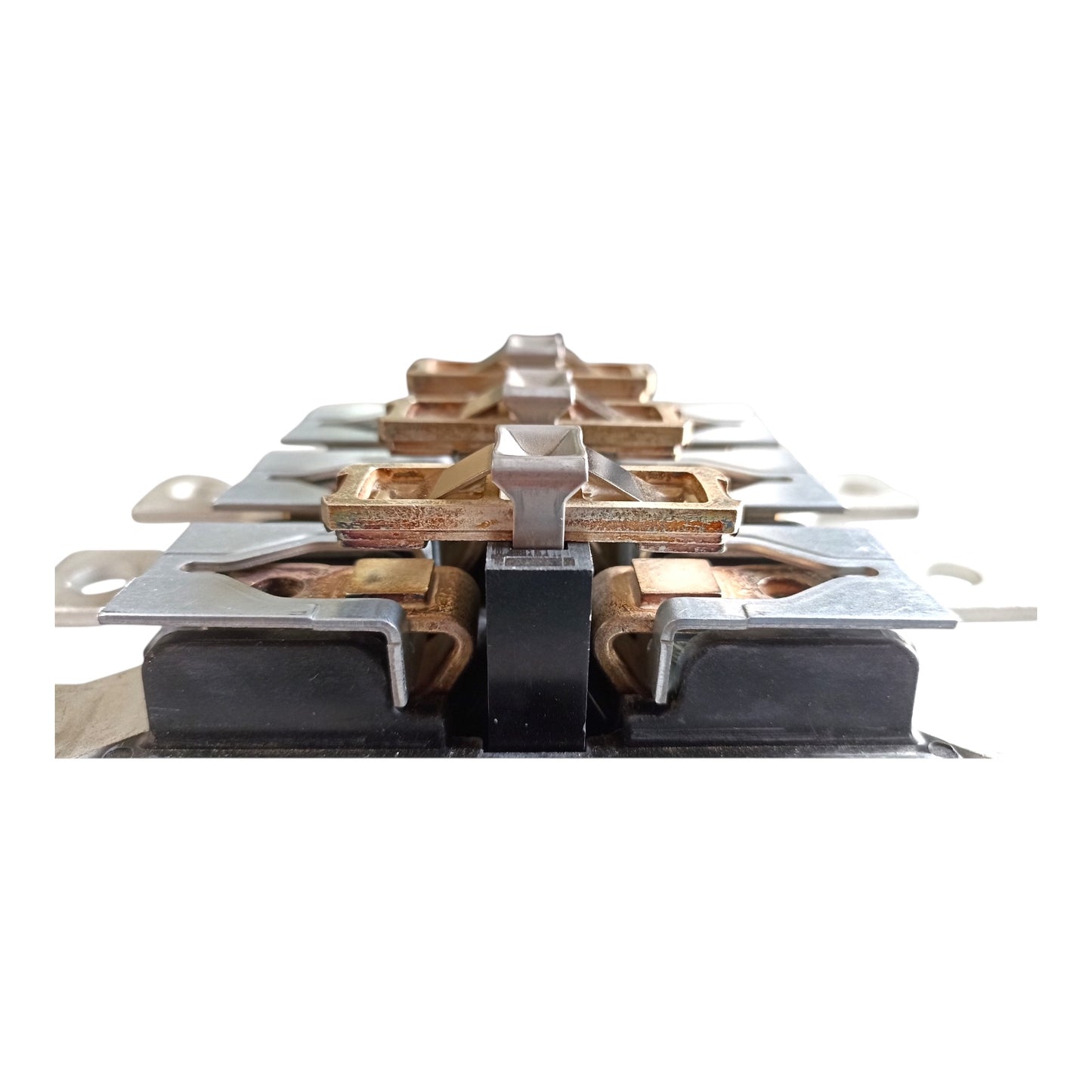 A close-up of a high-current electrical contactor or relay component, featuring copper-colored metal commutating rings, silver metal contacts, and black insulating blocks, set against a plain white background.