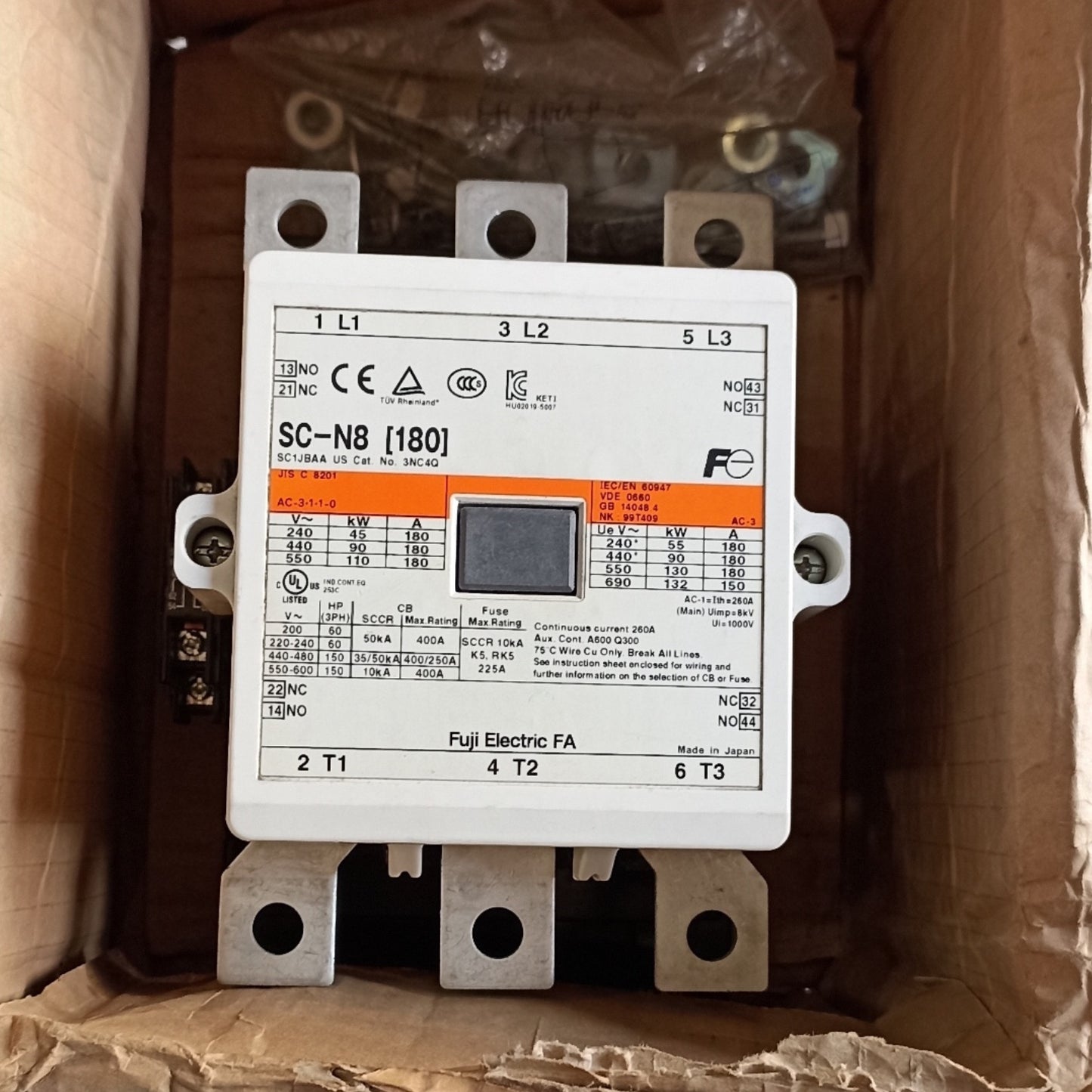 A Fuji Electric SC-N8 [180] contactor relay in its original cardboard packaging, showing the white front faceplate with technical specifications and a central digital display window.