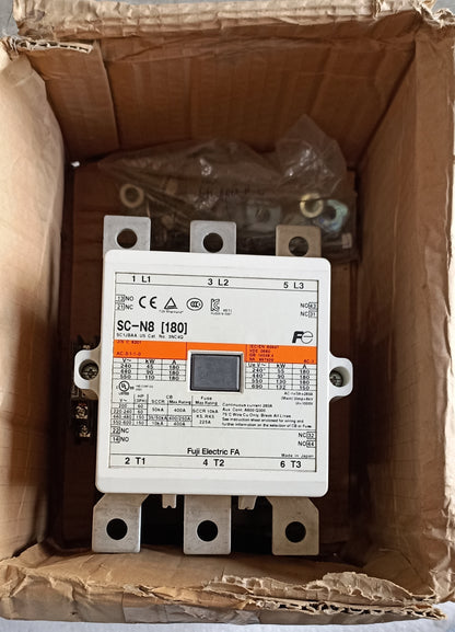 A full electric contactor terminal block, model SC-N8 [180] by Fuji Electric, still in its original brown cardboard box packaging.