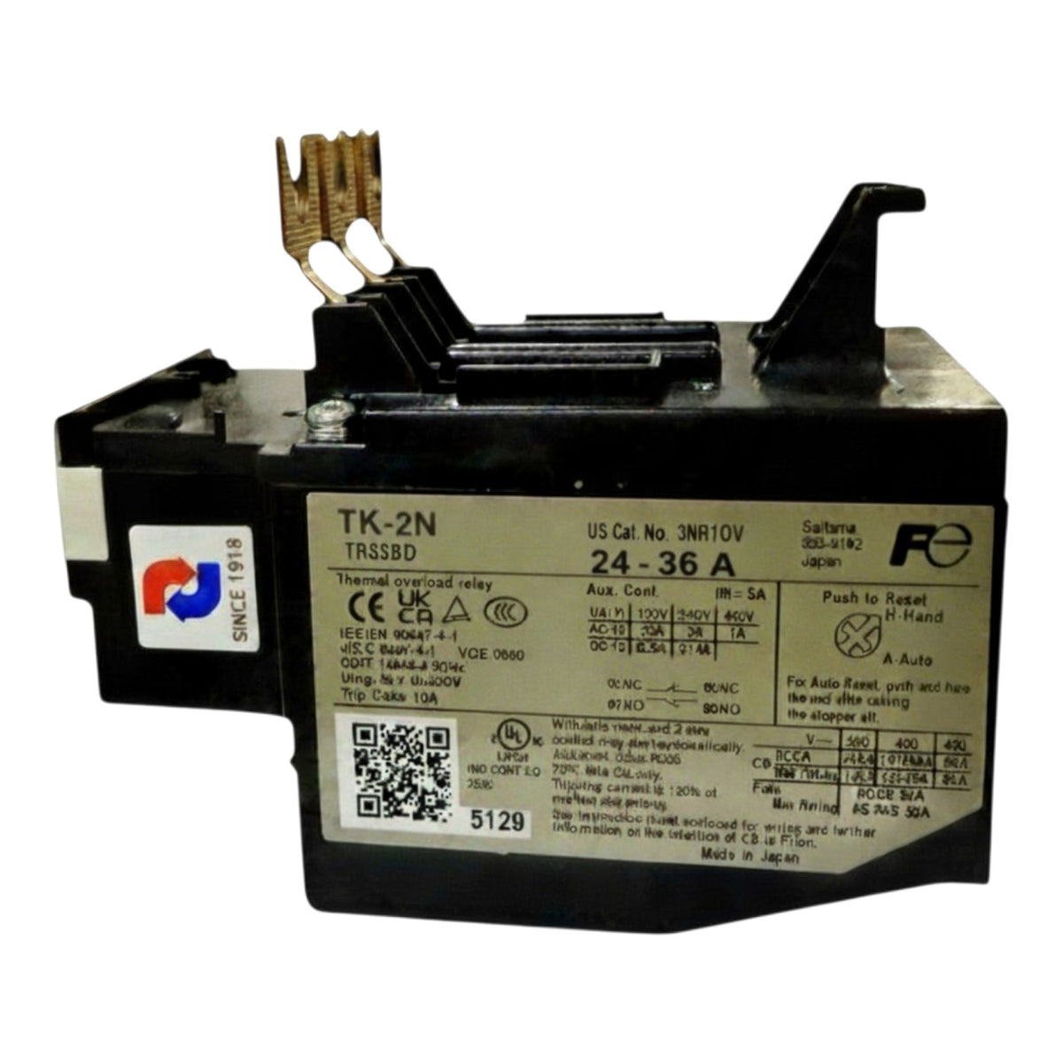 A black industrial electrical contactor relay with a silver label showing technical specifications and a push-to-start tab, photographed on a white background.