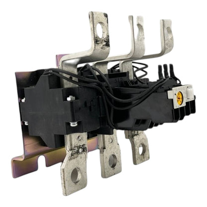 A heavy-duty electrical contactor or relay component with black plastic housing, silver metal terminal bars, and bundled black wires, shown on a plain white background.