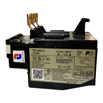 A black automotive battery with a large white specification label on the front, gold-colored terminal posts, and a small red and white 'SINE R&D' sticker on the side, photographed against a plain white background.