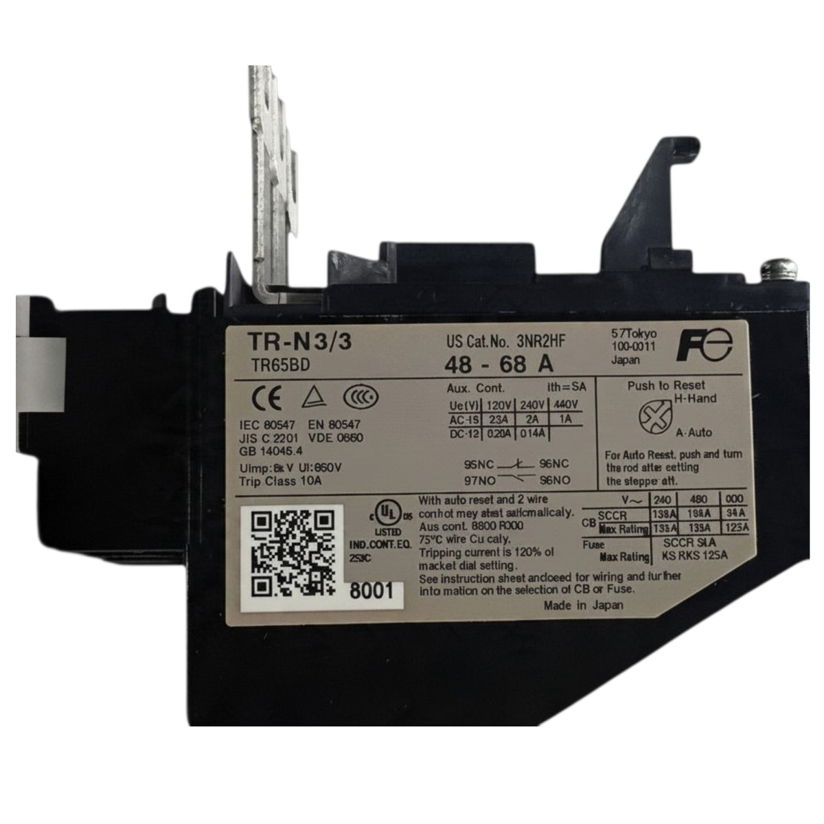 A black electrical fuse with a large white specification label on the front, photographed on a plain white background.