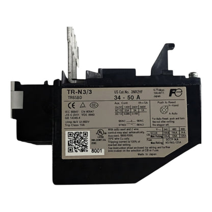 A black electrical contactor or relay component with a white technical specification label, photographed on a plain white background.