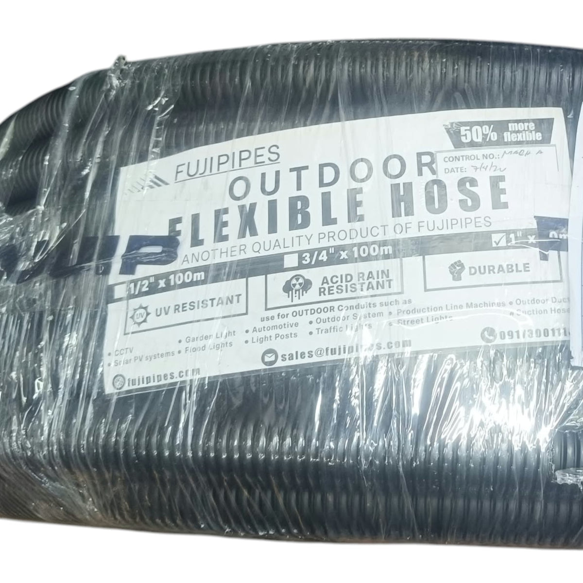 A coil of black outdoor flexible hose wrapped in clear plastic with a large white label reading FUJIPIPES and OUTDOOR FLEXIBLE HOSE.