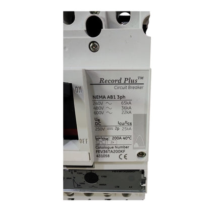 A close-up of a white electrical circuit breaker labeled 'Record Plus Circuit Breaker' with technical specifications printed on the front.