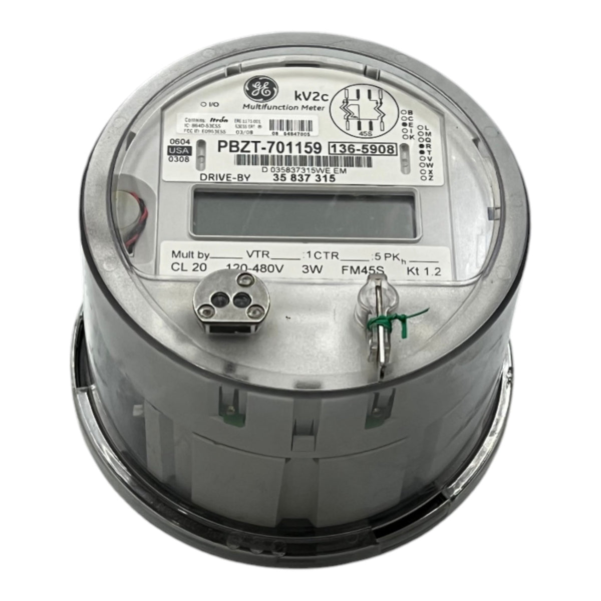 A GE 3-phase industrial digital watt-hour meter, model PBZT-701159, featuring a gray metal casing, a clear protective top cover, and an LCD display window.