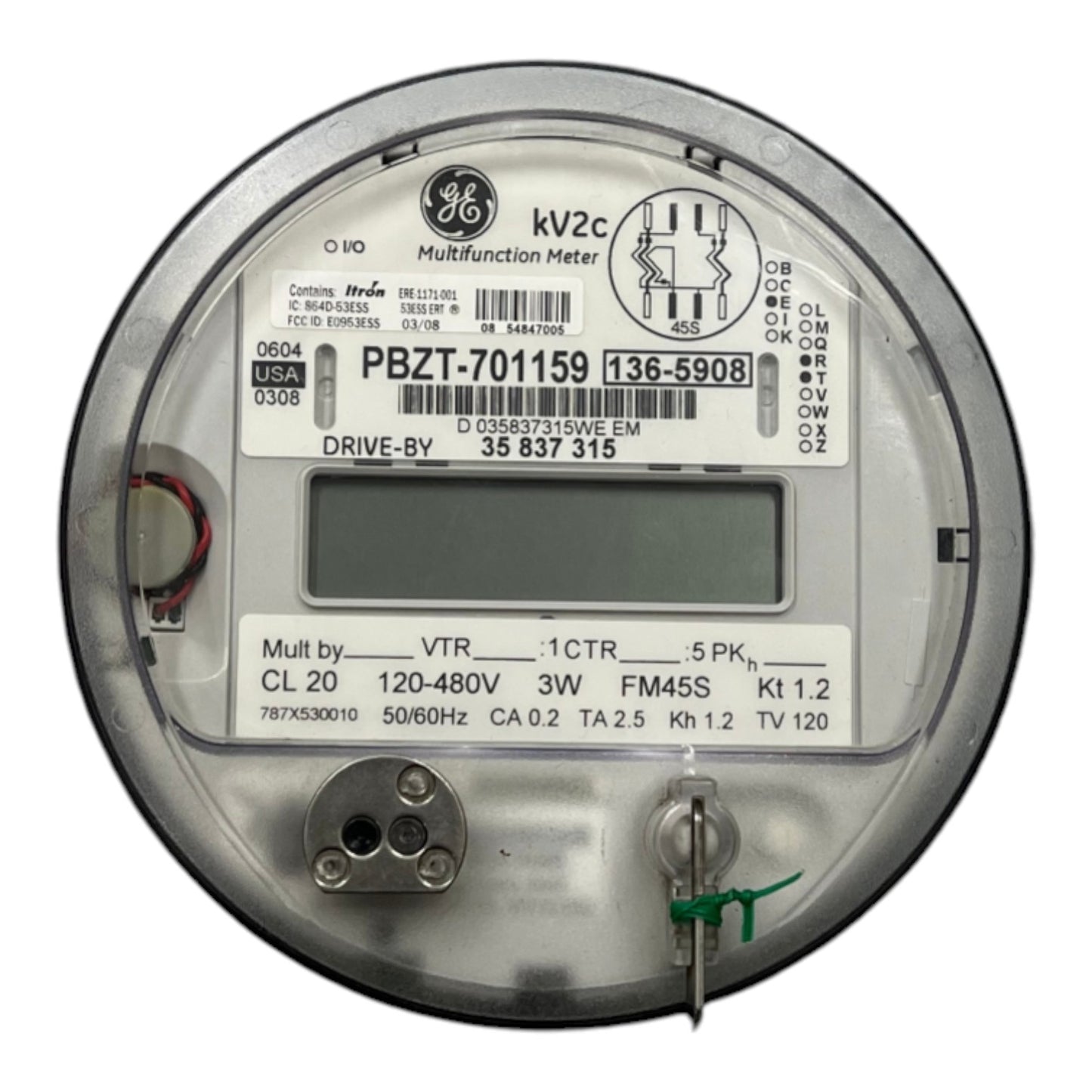 A round GE multifunction electricity meter with a digital display screen, technical specifications printed on the label, and metal terminals on a white background.