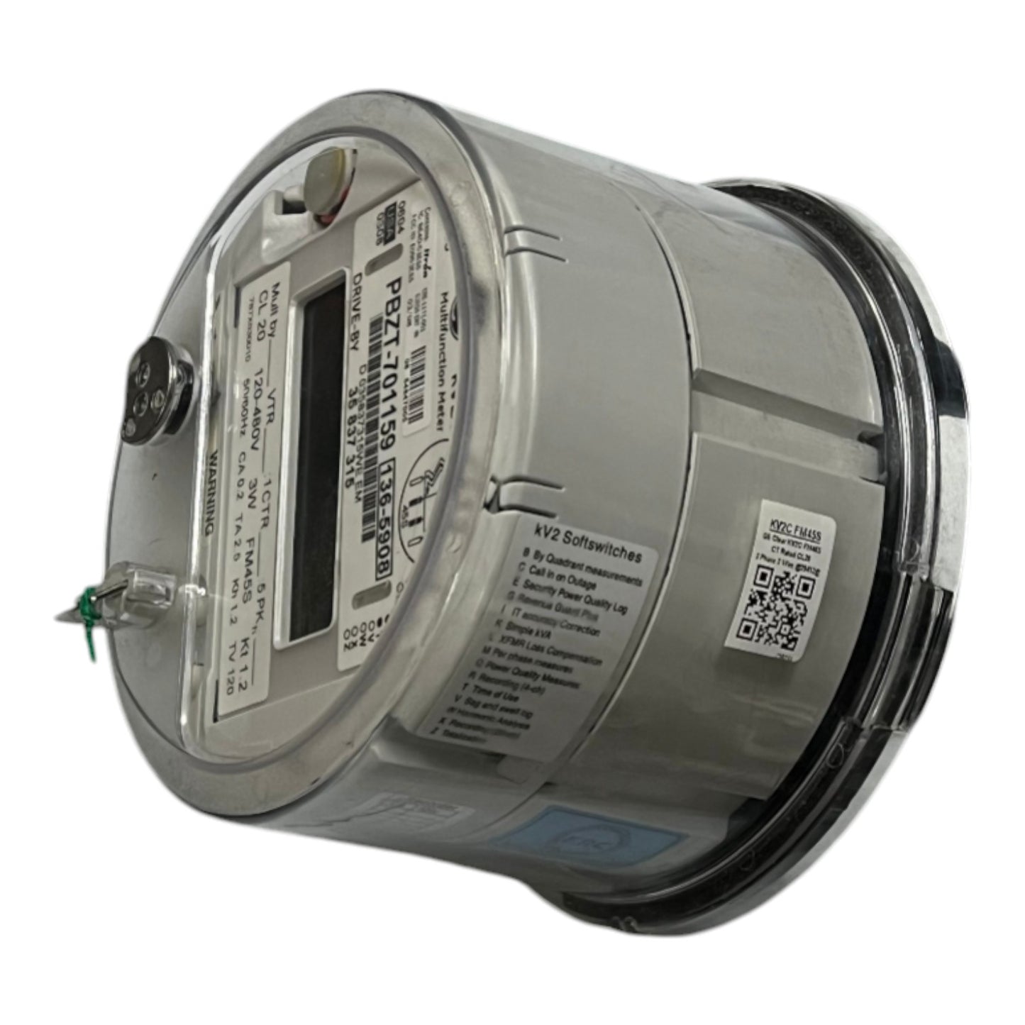 A cylindrical industrial electric meter with a brushed silver metal body, a clear protective cover, and various technical labels and QR codes printed on its surface.