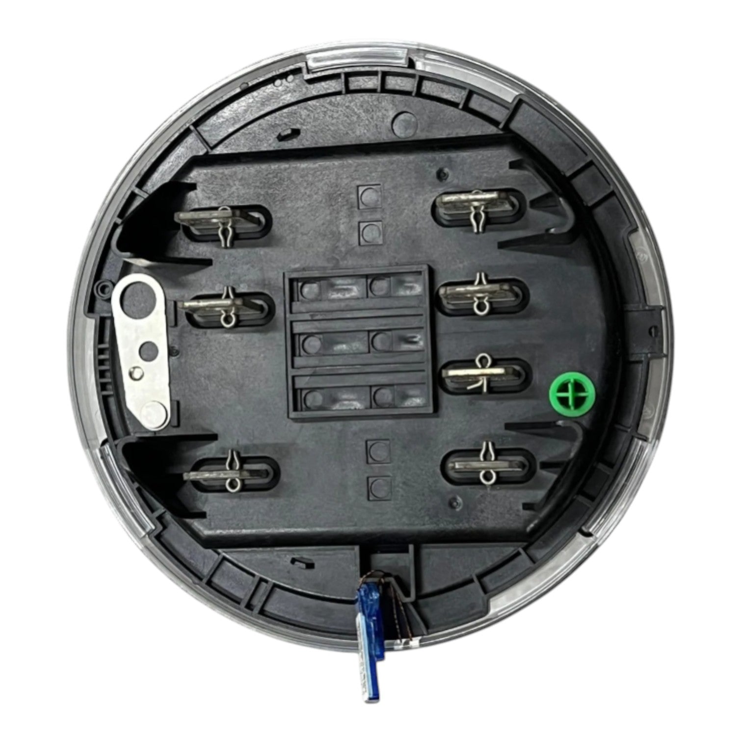 The underside of a circular black electrical junction box or terminal cover, showing metal screw terminals, a green positive terminal, a blue wire, and a silver metal bracket, isolated on a white background.