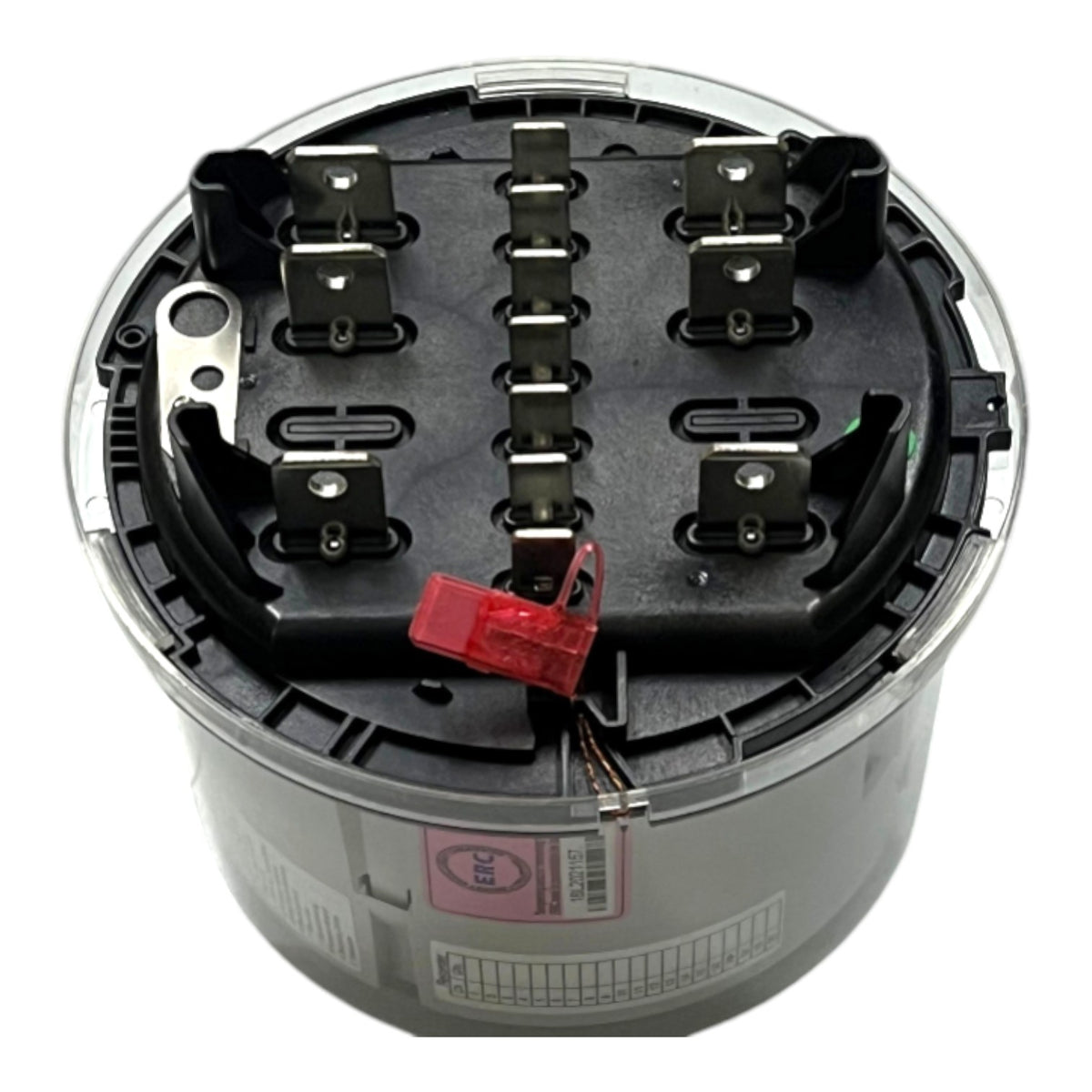 A cylindrical industrial electrical component, likely a terminal block or motor drive, featuring a black internal terminal assembly with metal contacts, a red plastic connector, and a gray outer casing with a clear top cover.