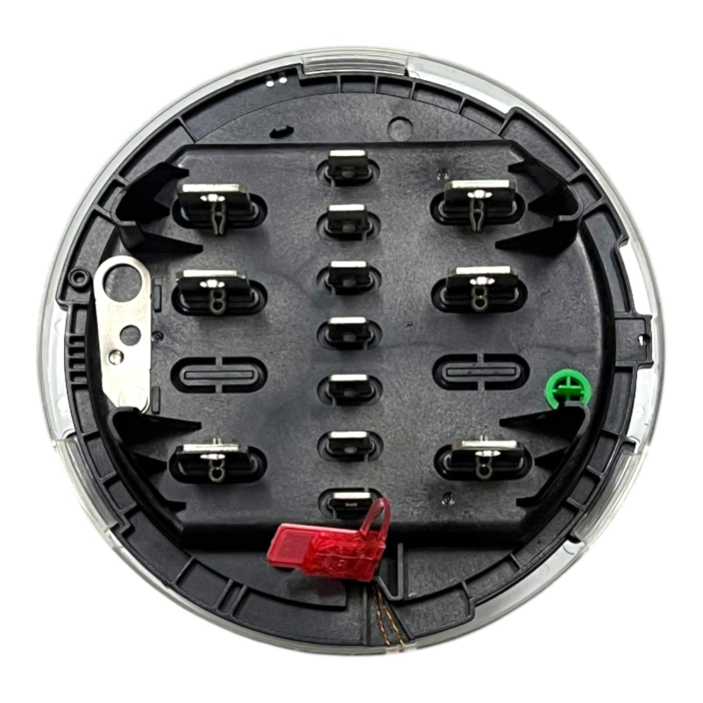 A circular automotive electrical connector housing with a black plastic base, silver metal contacts, a red fuse holder, and a green terminal, isolated on a white background.