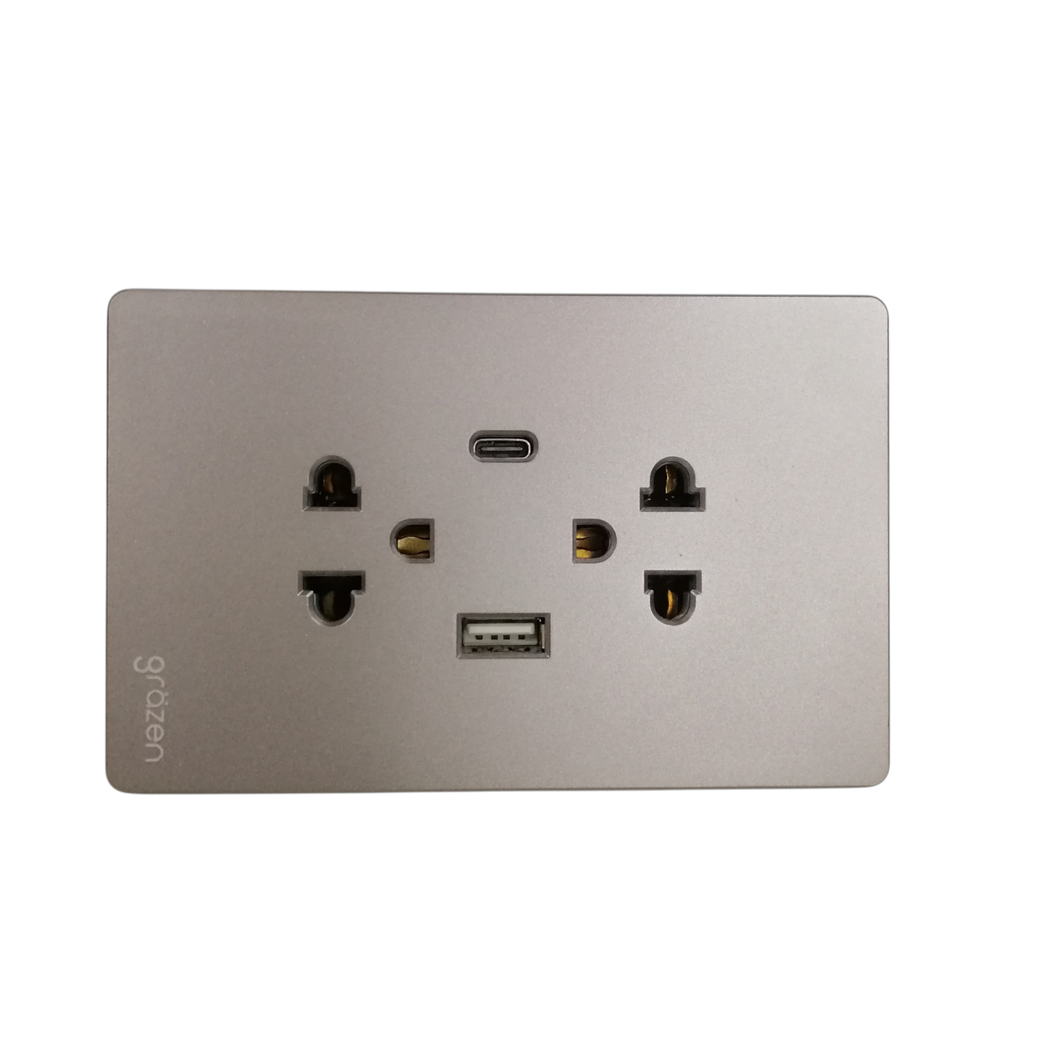 A brushed silver metal wall outlet panel featuring a USB-C port, a USB-A port, and dual US-style electrical outlets. The brand name 'gyozen' is printed vertically on the lower left.